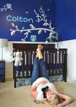 Owl baby nursery with navy blue walls and name decal