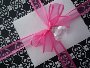 black and white gift wrap box package hot pink ribbon and faux diamond jewel decorations decorated