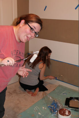 Painting the baby nursery wall in brown and white horizontal stripes was one of the best ideas ever
