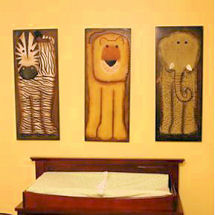 Safari jungle baby nursery theme with a diamond wall painting technique and brown giraffe print crib bedding