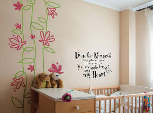 Baby nursery wall quote telling baby how much mom and dad love him or her.