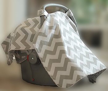 Baby car seat carrier cover that buttons onto the handle of your baby carrier made using a grey and white chevron pattern fabric