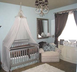 Chocolate brown and baby blue boy nursery with canopy crib