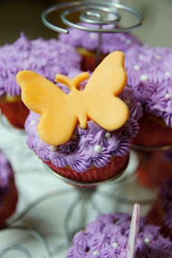 Purple baby girl shower cupcakes with fondant butterflies decorations