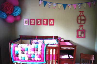 Pink owl nursery theme with custom owl baby bedding set in pink and blue for a girl