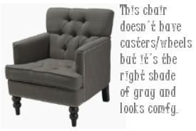 Charcoal gray tufted armchair for a baby nursery