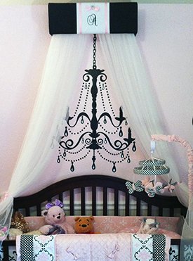 Custom made baby bed canopy in an elegant pink and black nursery decorated for a baby girl