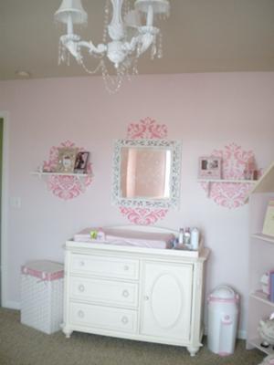 The Changing Area, Chandelier and Wall Decorations in our Whimsical and Elegant PInk Dreamland Baby Nursery Decor