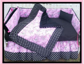 Pink gothic skull baby crib bedding set for a goth girl nursery theme