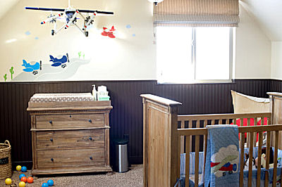 Nursery decorated in a jet airplane theme for a baby boy appropriately named 