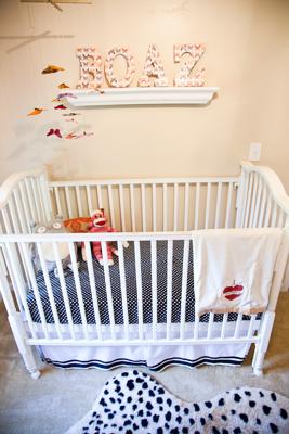 Boaz's Name on the nursery wall spelled in wooden letters that  I decoupaged with butterfly print paper from Michaels crafts store.