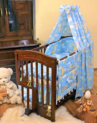 A blue and yellow moon stars and teddy bear baby boy nursery