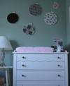 PInk and White Baby Changing Table with Black and White Polka Dot Drawer Pulls w Vintage Fabric Wall Decorations